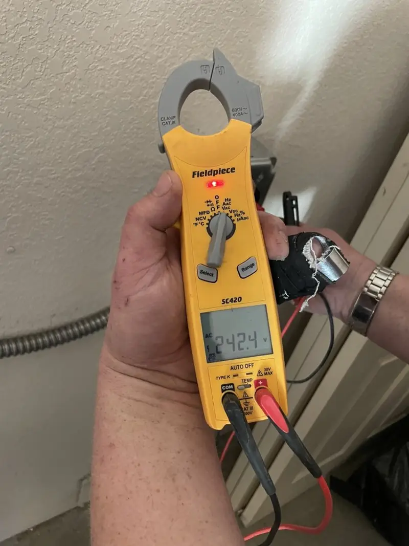 Voltage testing with clamp meter during Electrical Installation Services in Lynden